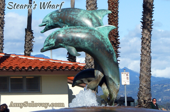 Close-Up Photo of the Dolphin Sculptures at the Entrance to Stearns Wharf.