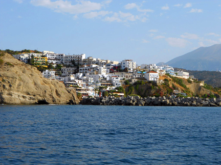 A View of Agia Galini. Photo Was Taken From a Sailboat Outside the Harbor, Sailing Towards the Greek Island of Crete. A View of Agia Galini. Photo Was Taken From a Sailboat Outside the Harbor, Sailing Towards the Greek Island of Crete.